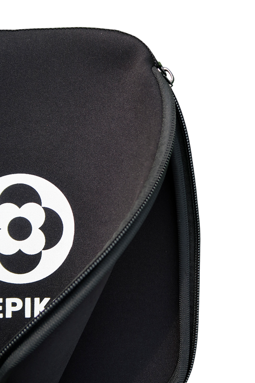 Close-up of a black zippered paddle cover with a white circular logo and partial white text on the left side, shown against a plain white background.